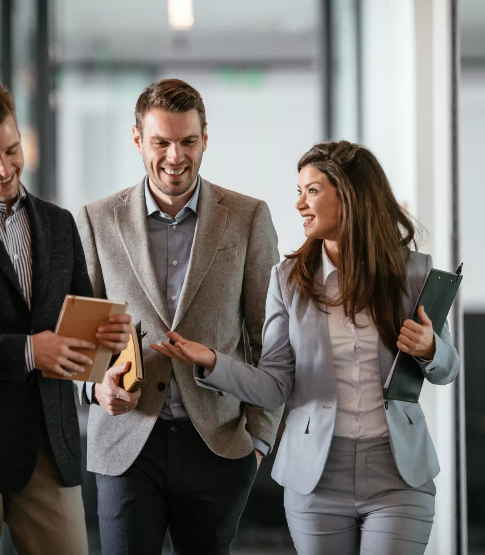 3 colleagues walking in the office